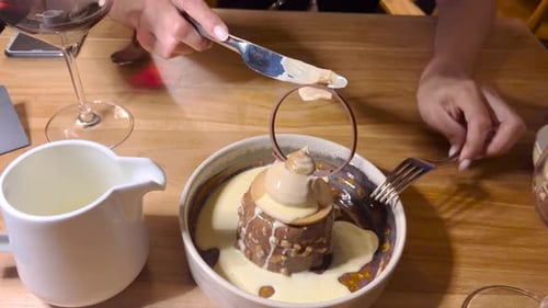close view of woman savors a glamorous dessert created by a chef in the Algarve, Portugal.