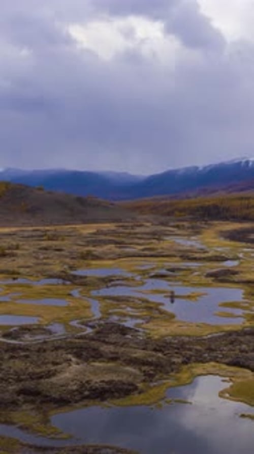Small Lakes and Clouds Reflection Eshtykel Plateau Altai Mountains Russia Vertical Video
