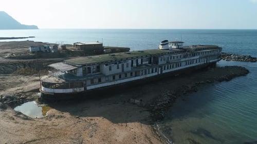 Abandoned Ship Resting on the Shore Near the Coast