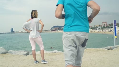 Couple Admire City View After Jogging
