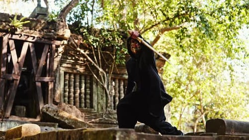 Masked Figure Practices Sword Fighting at Ancient Ruins