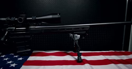 Black rifle and American flag