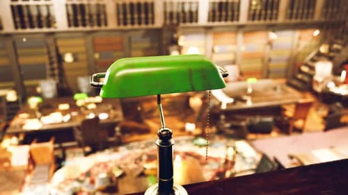 Old Library Interior Featuring Green Desk Lamp and Scattered Books