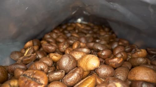 Coffee beans in the package close up 4K