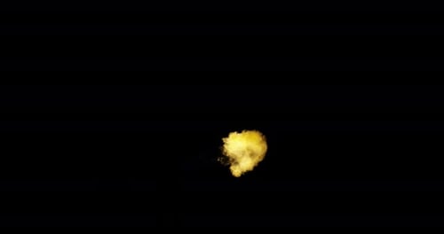 Ignite Collection: A fireball spurted sideways from left to right in center on dark background, shot