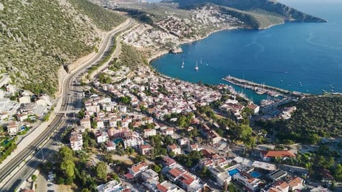 Aerial Video of Beachside Town and Calm Sea Under Early Sun