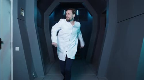 Man Dancing in a Futuristic Corridor