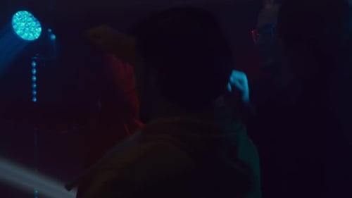 People Dancing Together Under Disco Ball at Nightclub