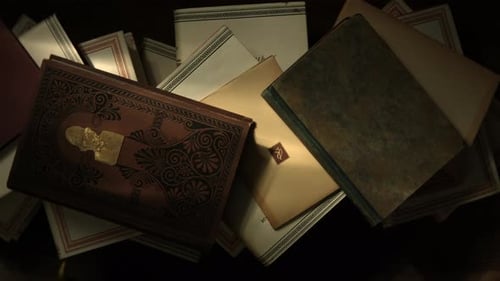 Top View of a Stack of Antique Books on a Wooden Table