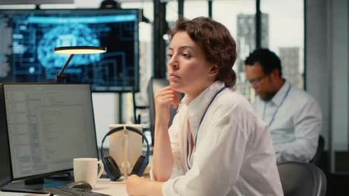 Cheerful Technician Working in Office Using AI Specialized Hardware