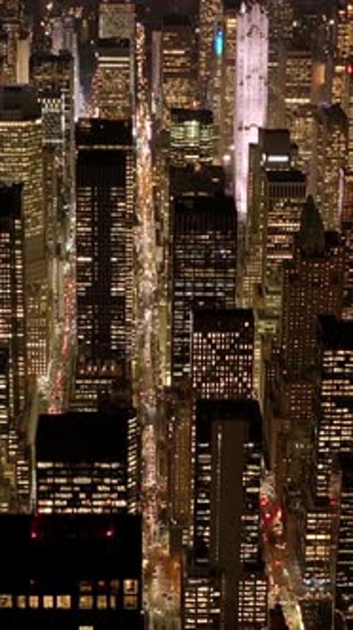 A Vibrant Cityscape at Night Filled with Illuminated Skyscrapers and Glowing Neon Lights