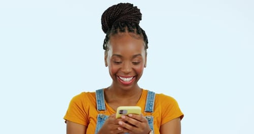 Woman Using Smartphone and Smiling