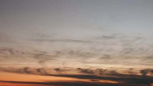 Vibrant Sunset Sky with Wispy Clouds