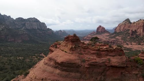 Huge red rocks formations stands in Sedona, Arizona. Aerial forward