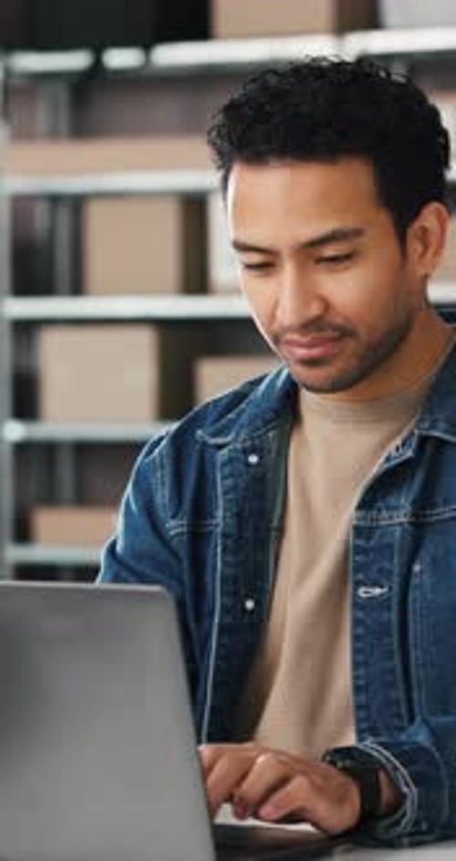 Businessman, typing and boxes with laptop for supply chain, online order or schedule in logistics
