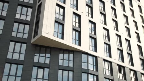 Modern Apartment Building Exterior with Gray and White Facade