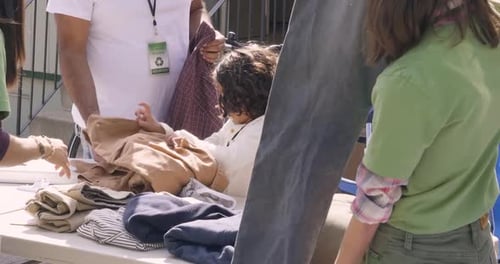 Volunteers Folding Clothes at Sunny Drive