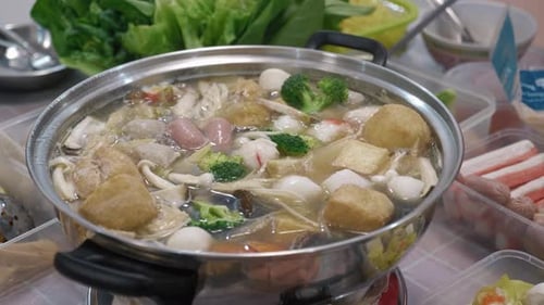 Traditional Chinese New Year Reunion Steamboat Hotpot Simmering Close Up