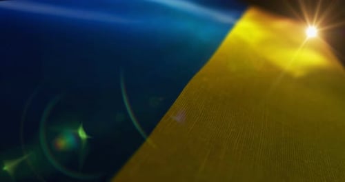 Dynamic Waving Blue and Yellow Flag Background with Lens Flare