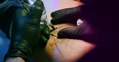 Milan/Italy-01.02.2019:Slow motion of professional master of the art of tattooing doing a tattoo t