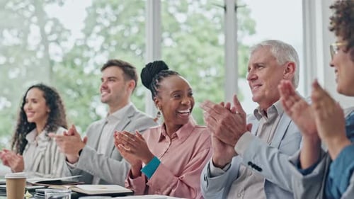 Business Team Clapping Hands in Meeting