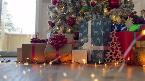 Gifts and Decorated Christmas Tree with Lights