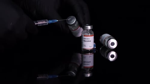 Drawing Vaccine Fluid From Vial with Syringe