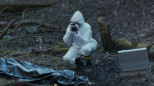 Forensic Specialist Working in the Forest Police Criminalists Collecting Evidence and Making