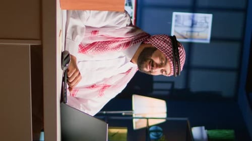 Bearded Man Works at Computer at Night