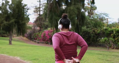 Curvy Woman Doing Stretching Before Sport Workout At Park - Plus Size Body And Sport