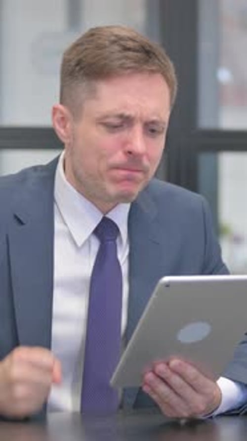 Vertical video, Mature Adult Businessman Facing Online Loss on Digital Tablet