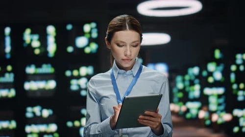 Woman Using Tablet in a Modern Tech Office