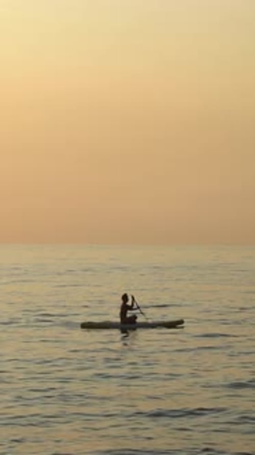 Sunset Paddleboarding Serenity on Sea