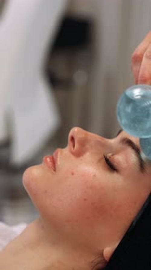 Relaxing Face Massage With Cold Globes at Spa