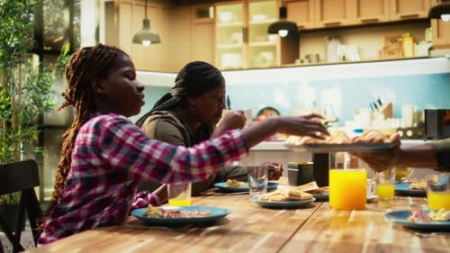 Family Enjoying Breakfast Together at Kitchen Table