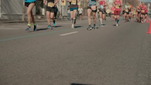 Group of Runners Compete in Marathon or Triathlon