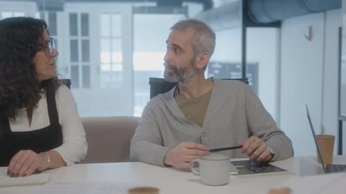 Senior Business People Having Discussion during Meeting in Office