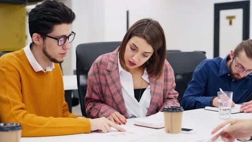Office Employees Sit and Discuss on Startup Project in Conference Room with Charts Team of Business