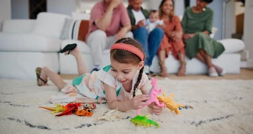 Kid, girl and playing with toys in living room for mobility, development or game in family home