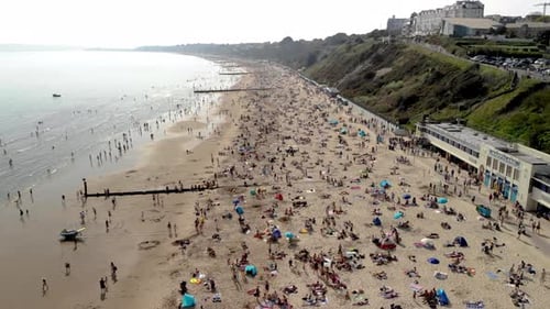 Bournemouth Pier - Hoovering over beach, dolly in