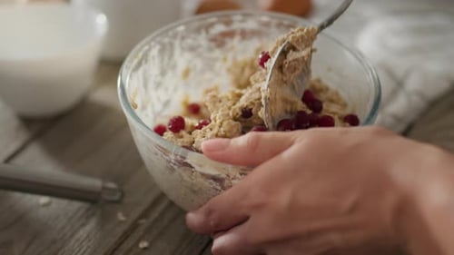 Cookie. Housewife prepares dough for pancakes and cookies in the cozy kitchen at home. Close-up of