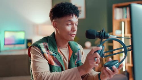 Influencer, microphone and headphones with man in studio for review, tech advice and advertising