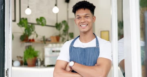 Man, face and coffee shop barista with smile or customer service or waiter at bakery