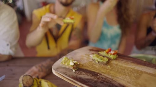 Friends Enjoying Avocado Toast at a Table