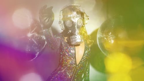 Glittery Woman Wearing Gas Mask and Dancing