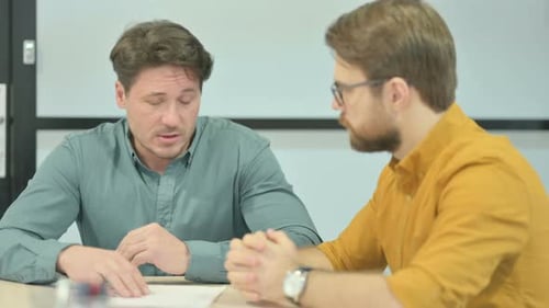 Men Discussing Business at a Table