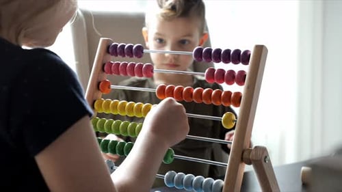 Brother and Sister Playing with Toy Abacus 45 Years