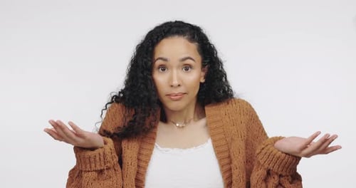 Confused, don't know and shrugging with black woman in studio for problem, guilty and puzzled