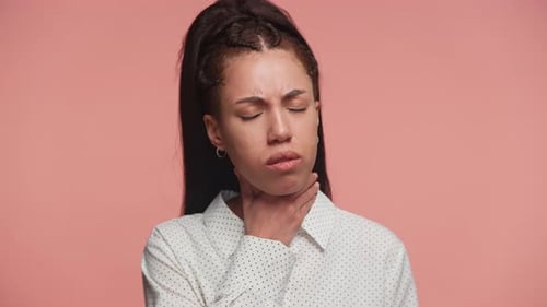 Woman Experiencing Throat Pain and Nausea