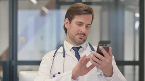 Doctor Using Mobile Phone at the Hospital